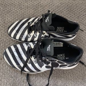 Like new Nike free athletic shoes, black and white pattern